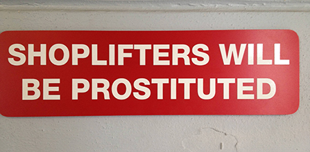 Sign that reads Shoplifters will be prostituted
