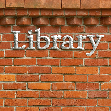 Brick wall with the word Library on it